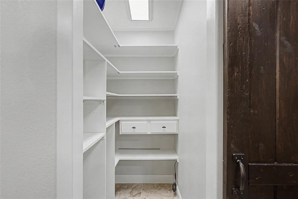 1701 Central Road Weatherford, TX 76088 - Photo 21 of 40 Pantry with sliding door off the kitchen with ample shelving.