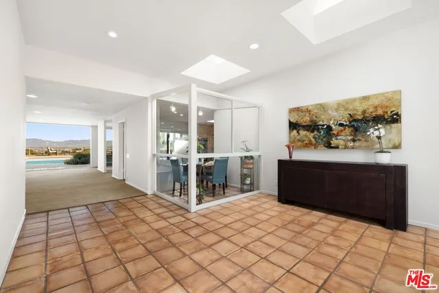 a view of a bedroom with wooden floor