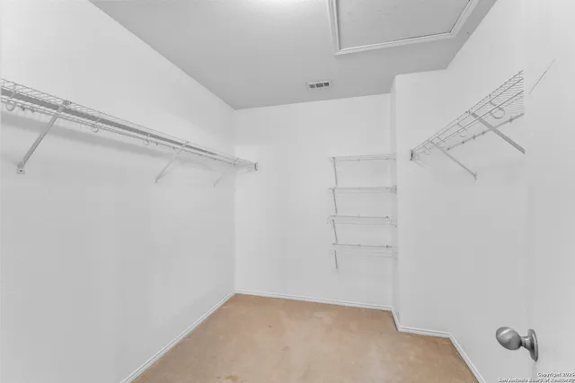 a view of an empty walk in closet
