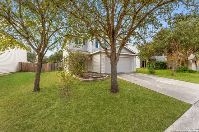 a backyard of a house with lots of green space