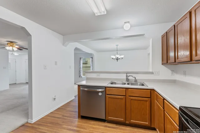 a kitchen with a sink and cabinets