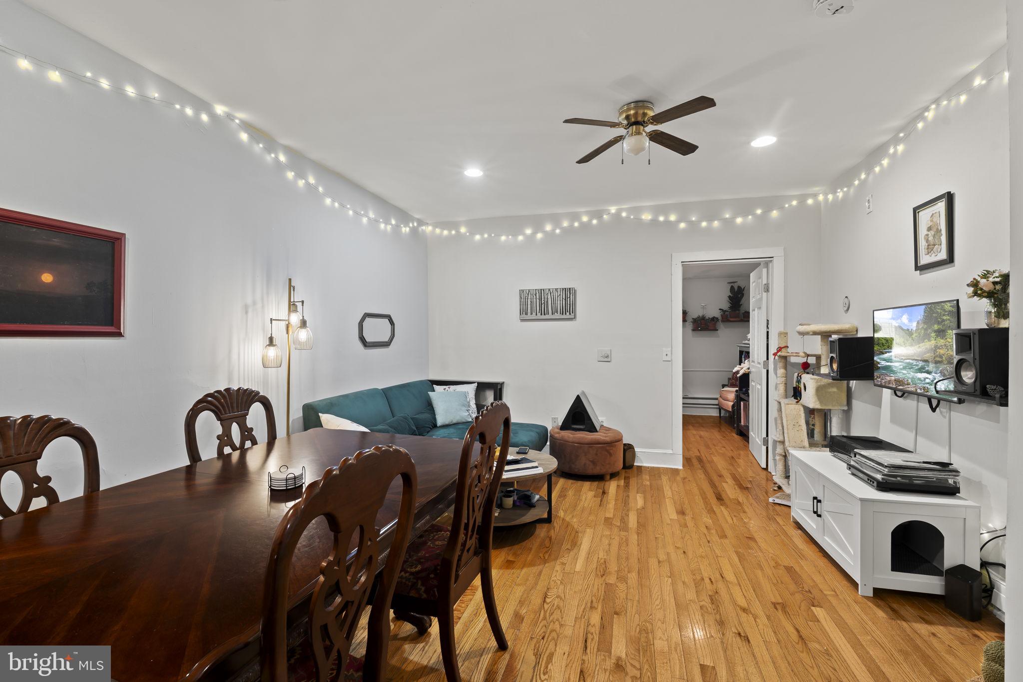 4630 Chester Avenue Philadelphia, PA 19143 - Photo 30 of 46 a view of a dining room with furniture and a flat screen tv
