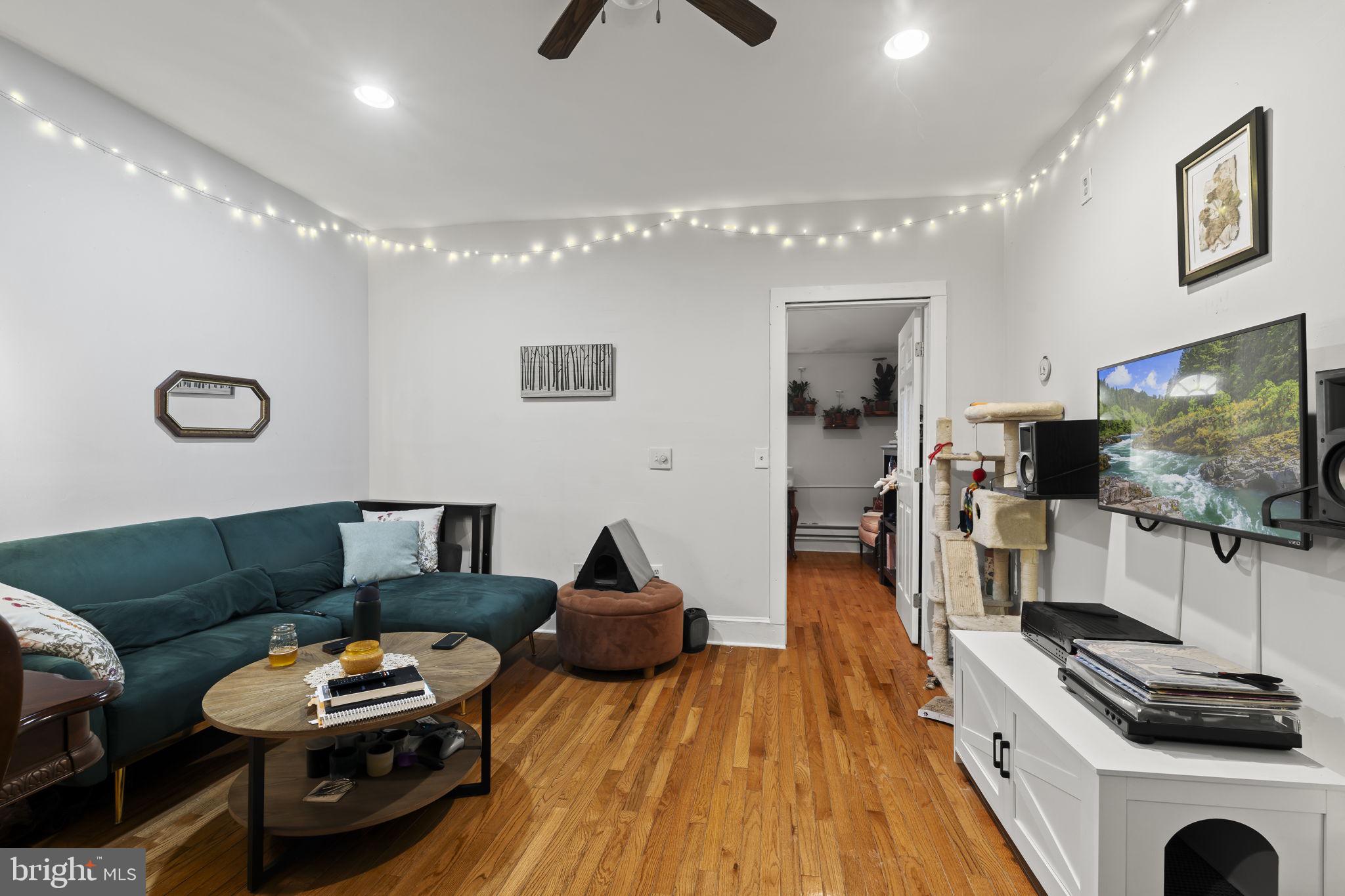 4630 Chester Avenue Philadelphia, PA 19143 - Photo 31 of 46 a living room with furniture and a flat screen tv