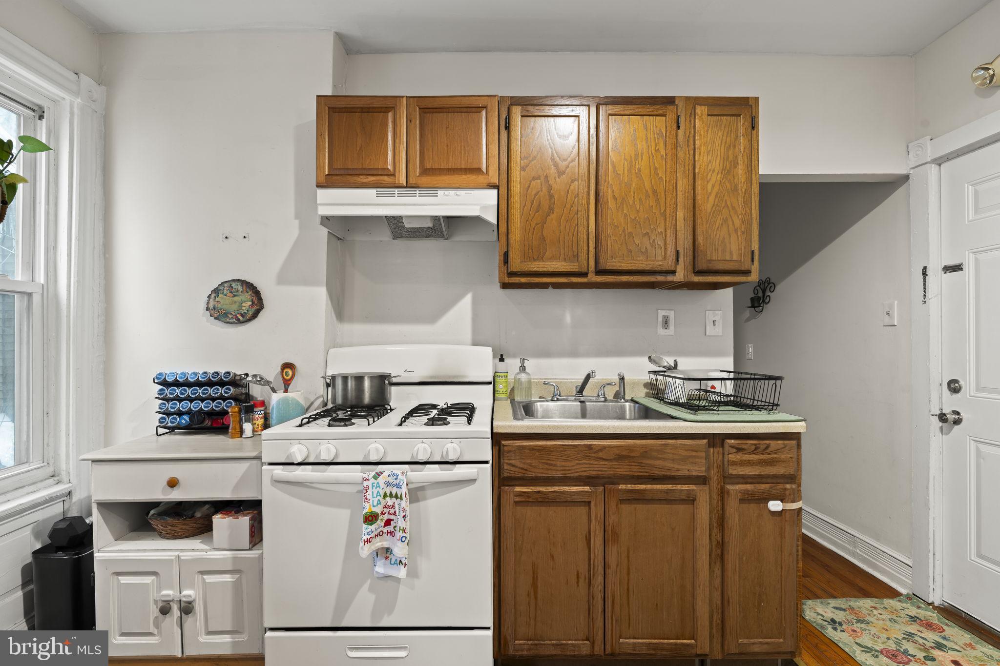 4630 Chester Avenue Philadelphia, PA 19143 - Photo 34 of 46 a utility room with cabinets washer and dryer