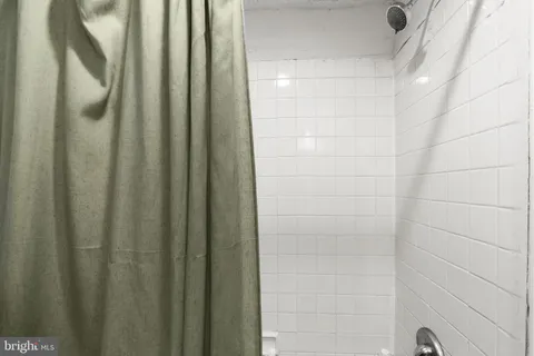 a bed room with a bed and a television