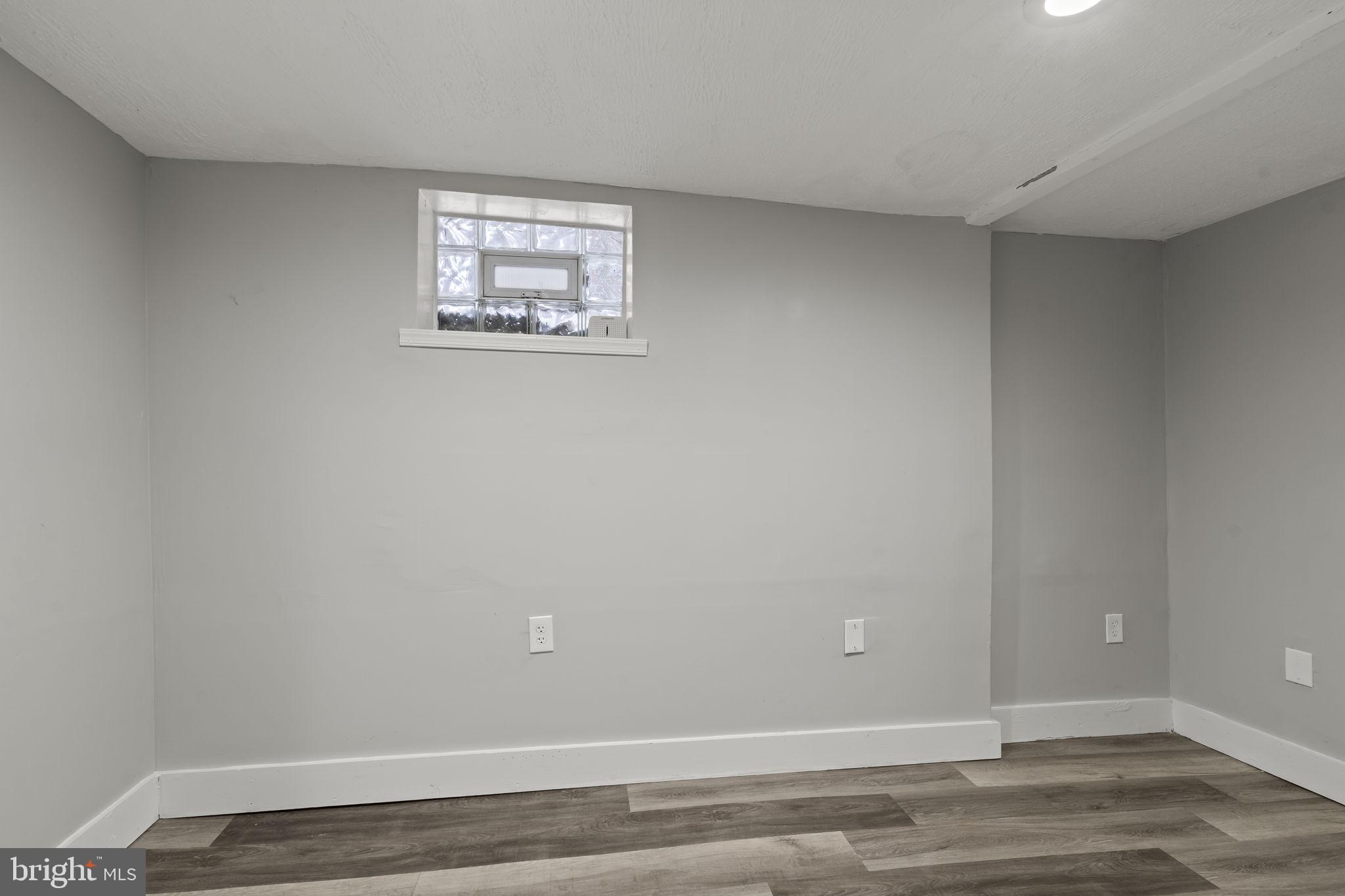 4630 Chester Avenue Philadelphia, PA 19143 - Photo 9 of 46 a view of a small space with wooden floor and a window