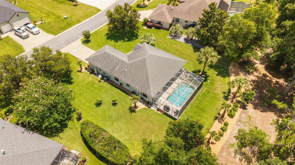 19639 Southwest 77th Loop Dunnellon, FL 34432 - Photo 1 of 59 an aerial view of a swimming pool