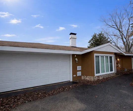a front view of a house with a garage