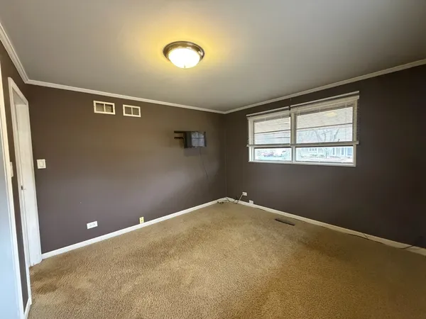 a view of an empty room with a flat screen tv