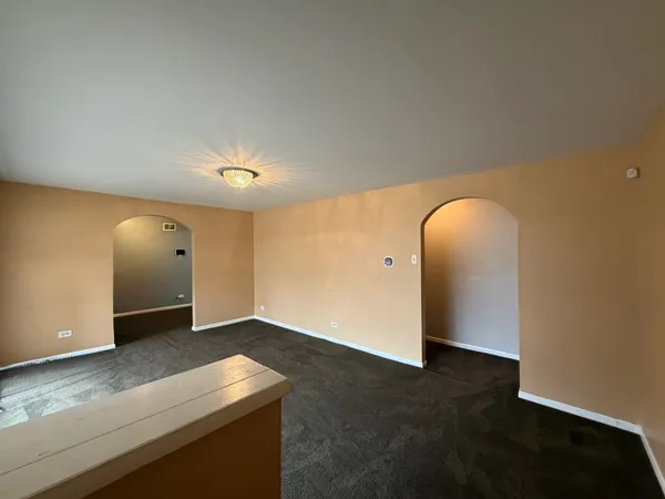 an empty room with mirror
