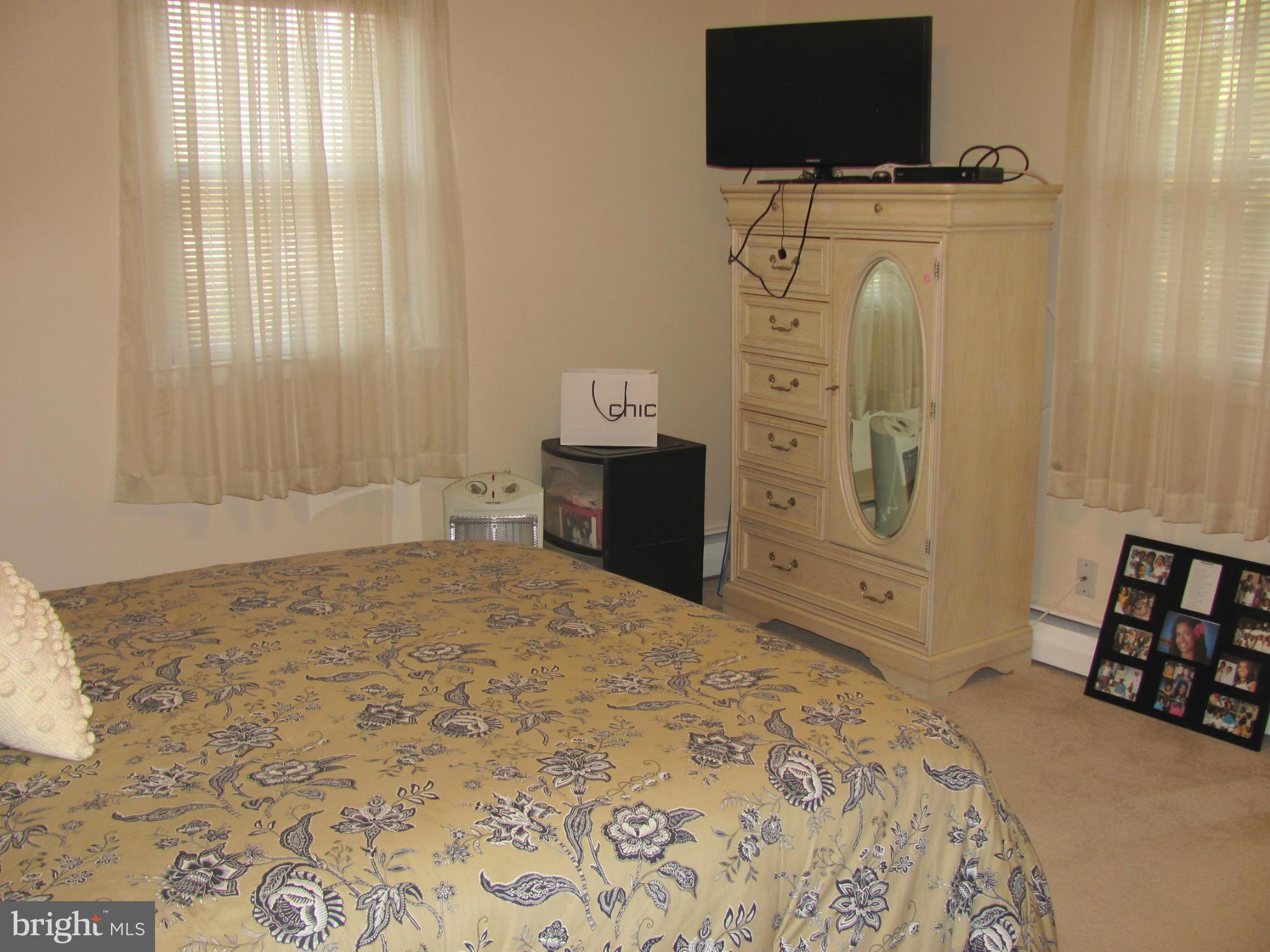 3645 Langrehr Road Baltimore, MD 21244 - Photo 15 of 25 a bedroom with a bed and a flat screen tv