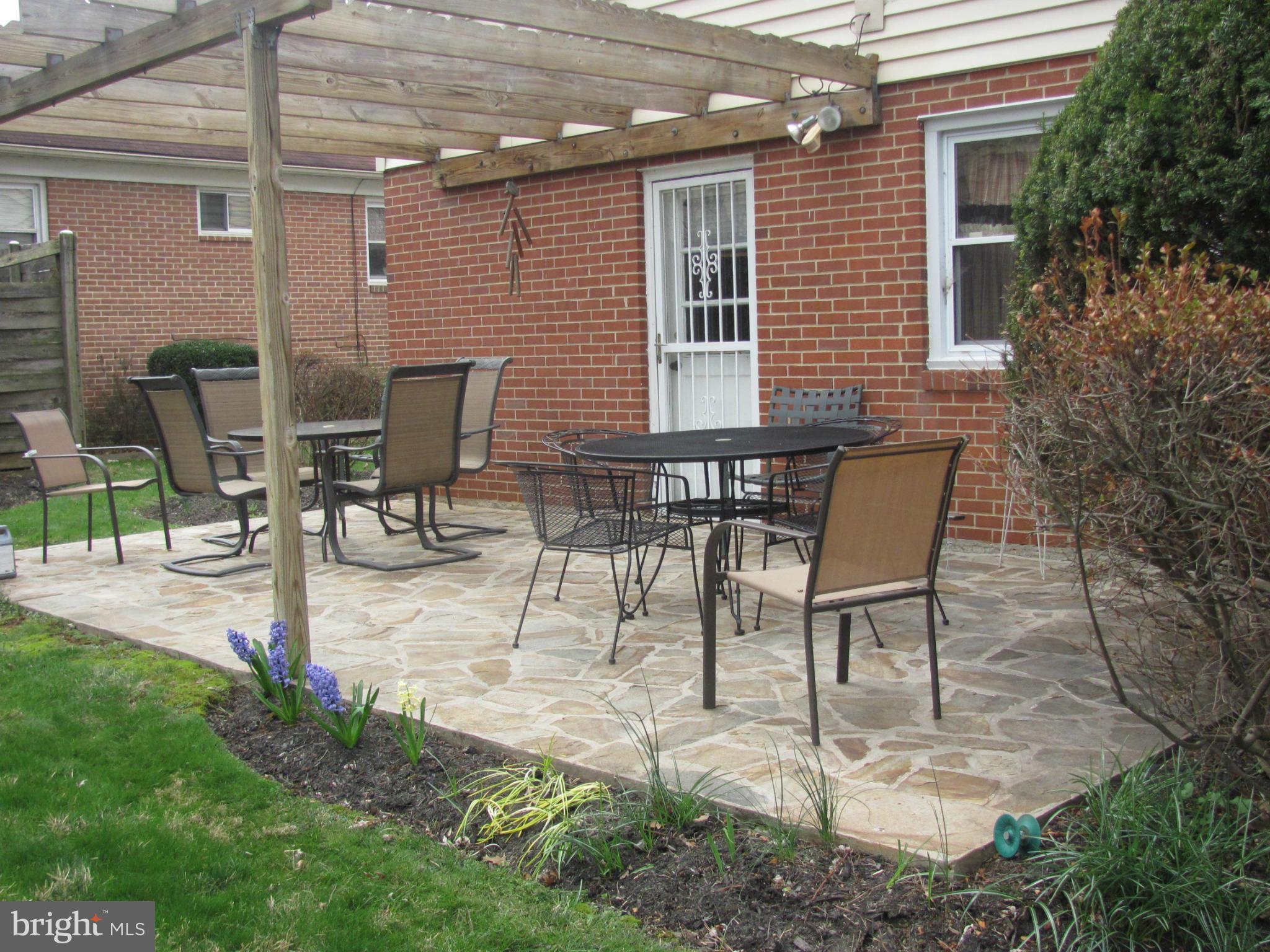 3645 Langrehr Road Baltimore, MD 21244 - Photo 24 of 25 a view of a patio with table and chairs and potted plants