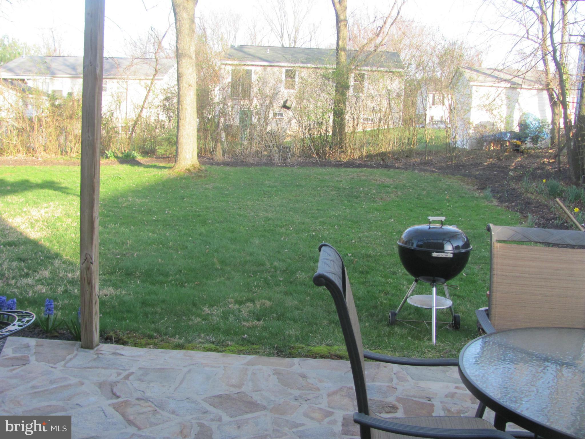3645 Langrehr Road Baltimore, MD 21244 - Photo 25 of 25 a backyard of a house with table and chairs