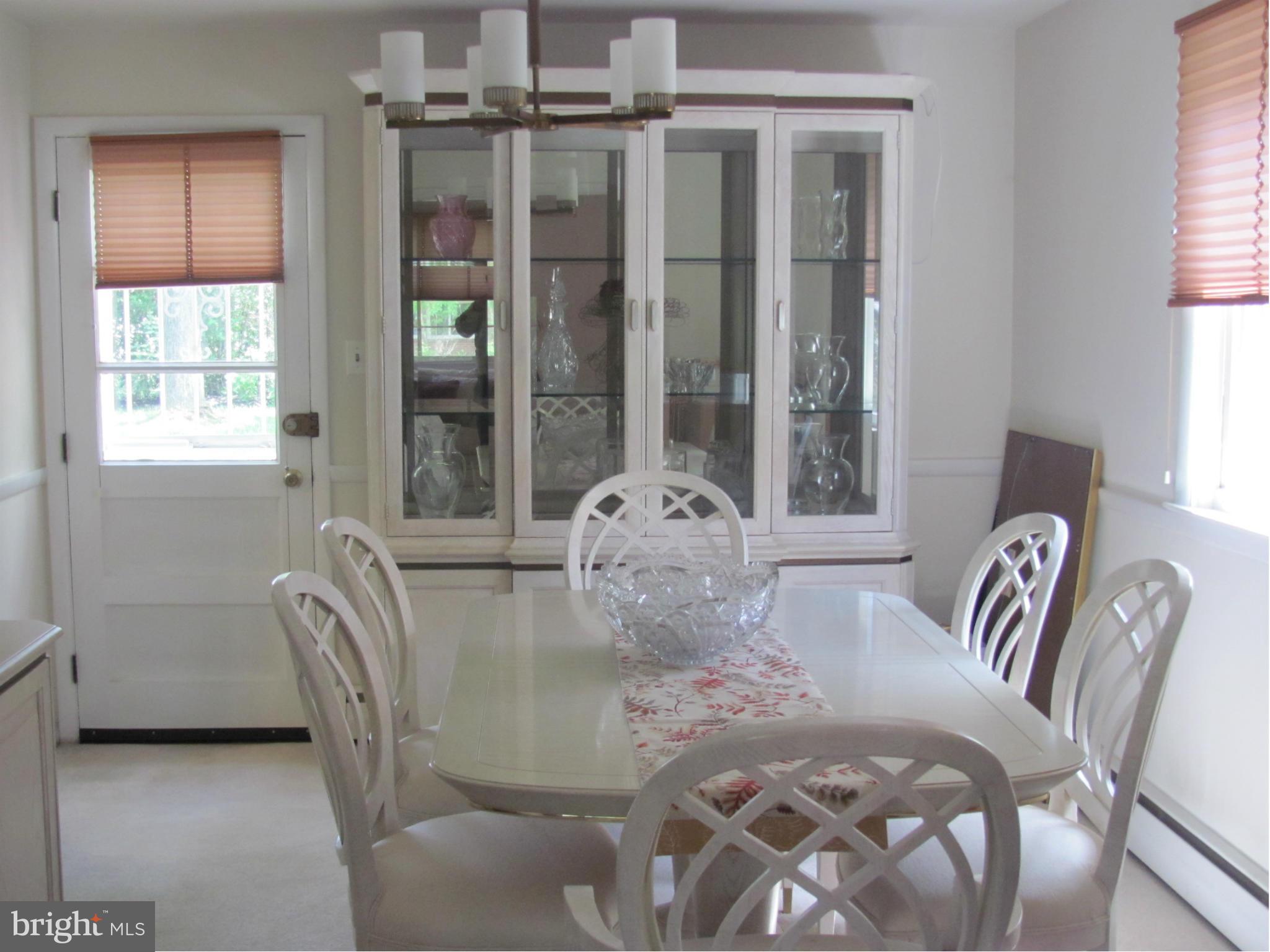 3645 Langrehr Road Baltimore, MD 21244 - Photo 7 of 25 a view of a dining room with furniture and window