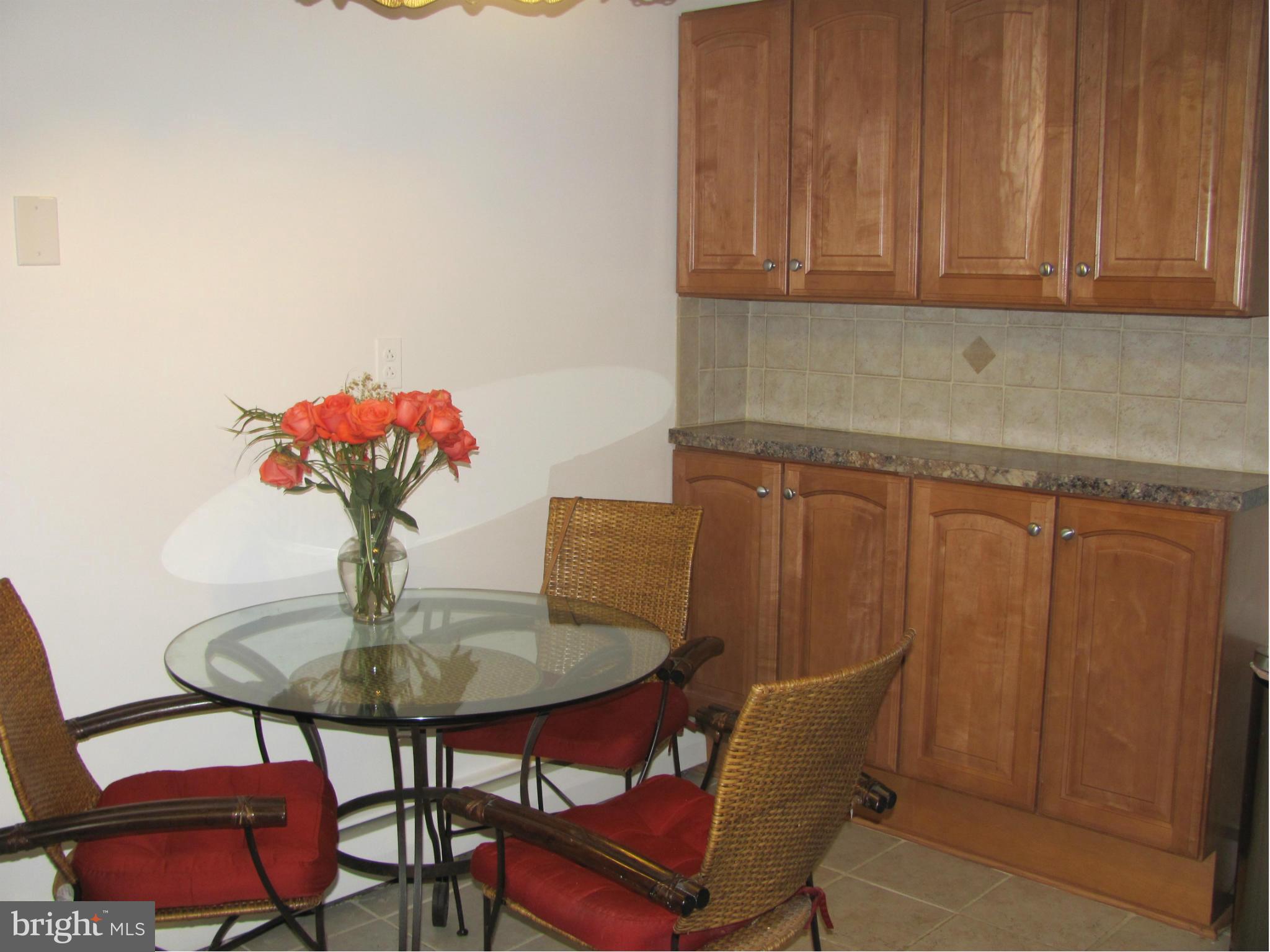 3645 Langrehr Road Baltimore, MD 21244 - Photo 10 of 25 a dining room with furniture and wooden floor