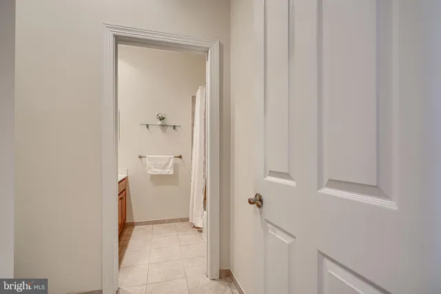 a living room with furniture and large windows