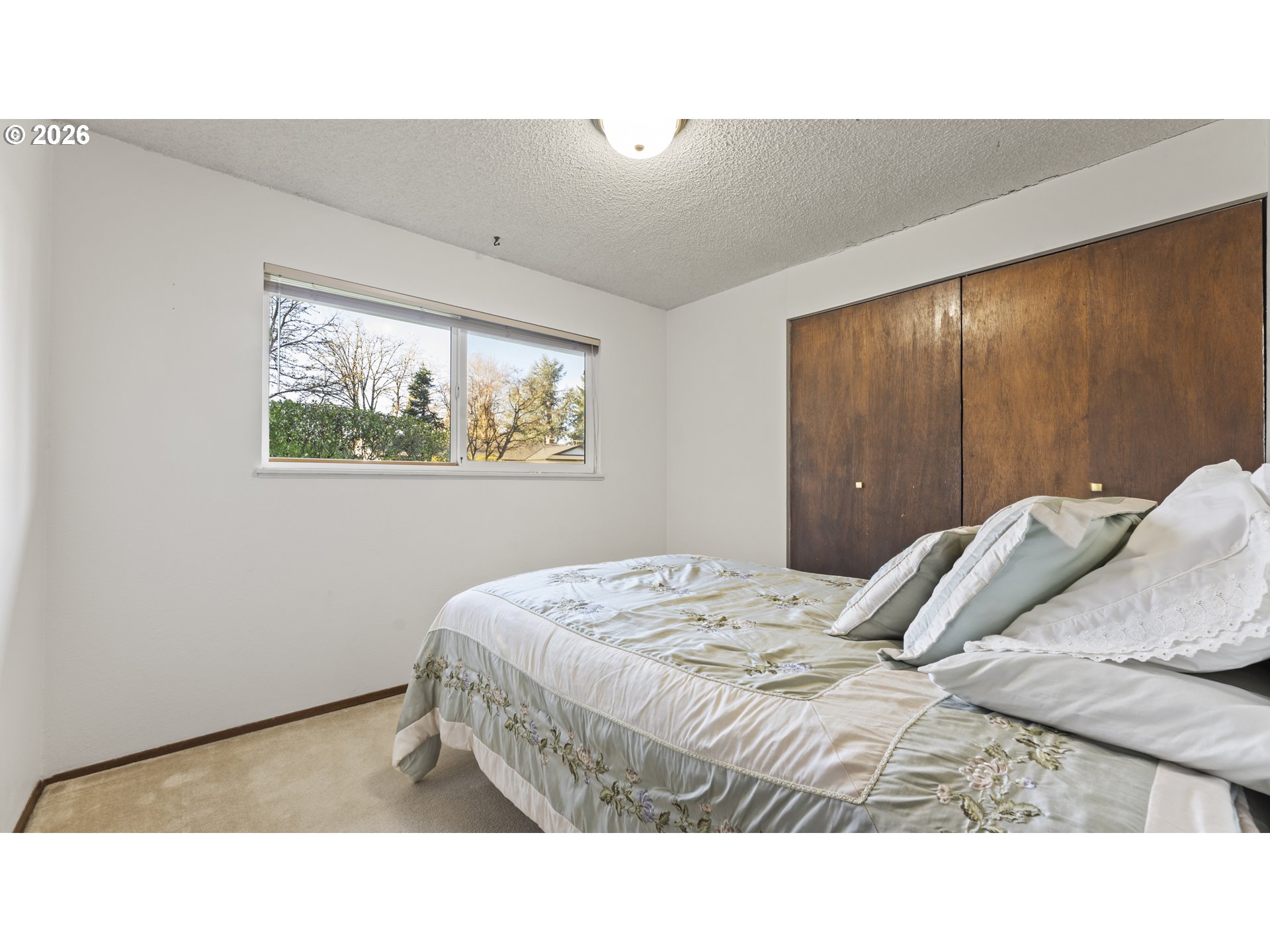 816 Northeast 193rd Avenue Portland, OR 97230 - Photo 14 of 28 a bedroom with a bed and a painting