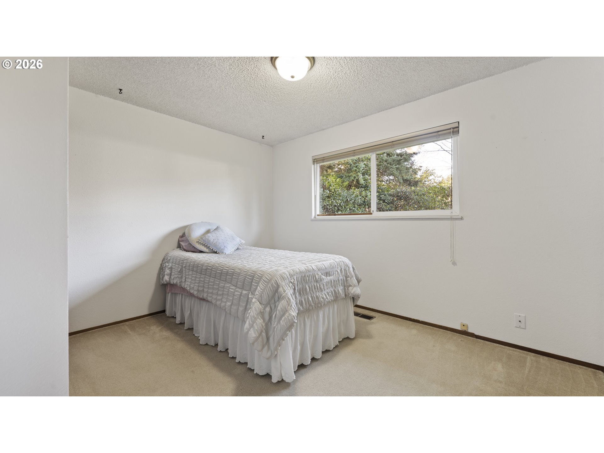 816 Northeast 193rd Avenue Portland, OR 97230 - Photo 18 of 28 a living room with a bed furniture and a window