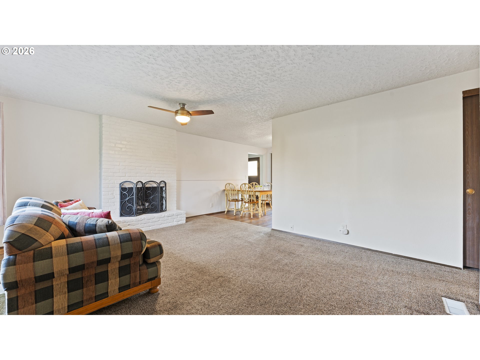 816 Northeast 193rd Avenue Portland, OR 97230 - Photo 4 of 28 a living room with furniture and a flat screen tv
