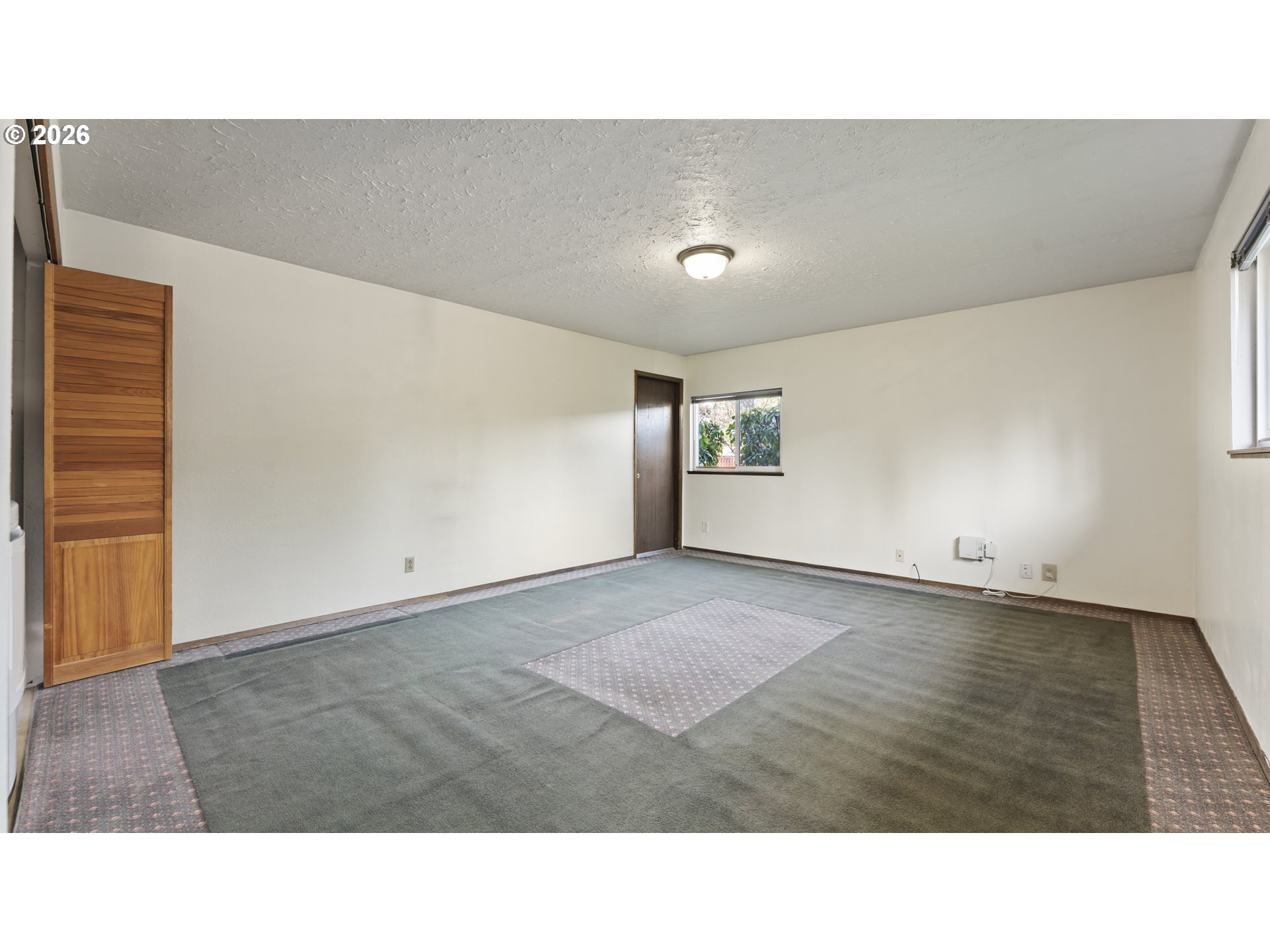 816 Northeast 193rd Avenue Portland, OR 97230 - Photo 9 of 28 a open hall with a bench