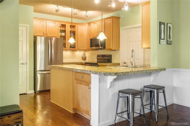 a bathroom with a sink a mirror and a shower
