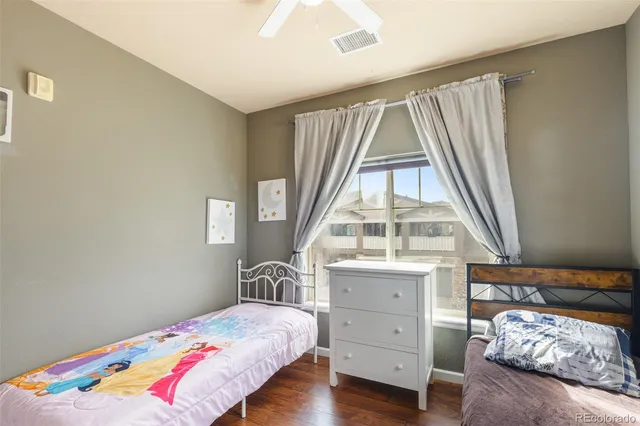 a view of bedroom with furniture and windows