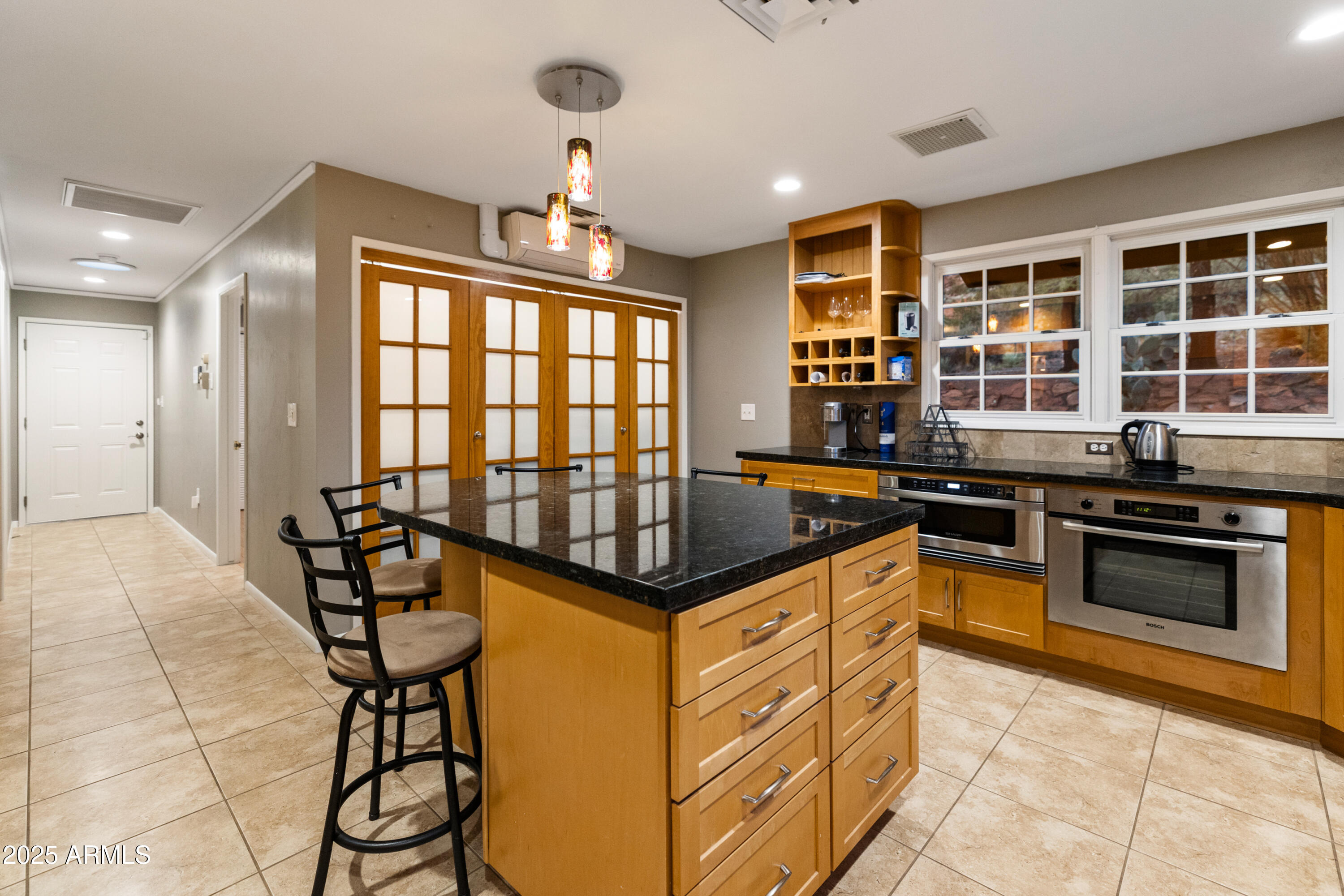 195 Courthouse Butte Road Sedona, AZ 86351 - Photo 13 of 31 a kitchen with stainless steel appliances granite countertop a stove and a refrigerator
