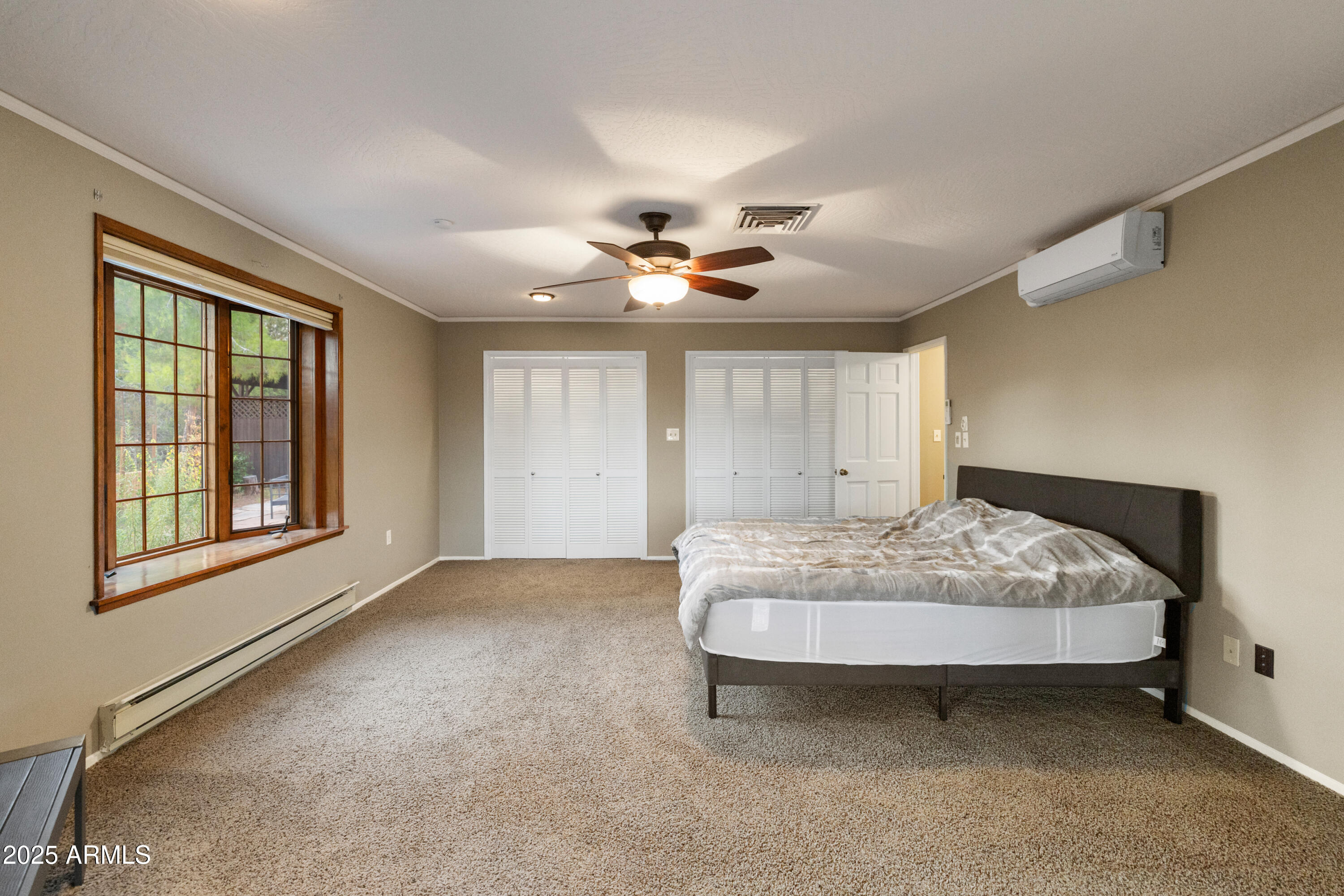 195 Courthouse Butte Road Sedona, AZ 86351 - Photo 20 of 31 a bedroom with a bed and window