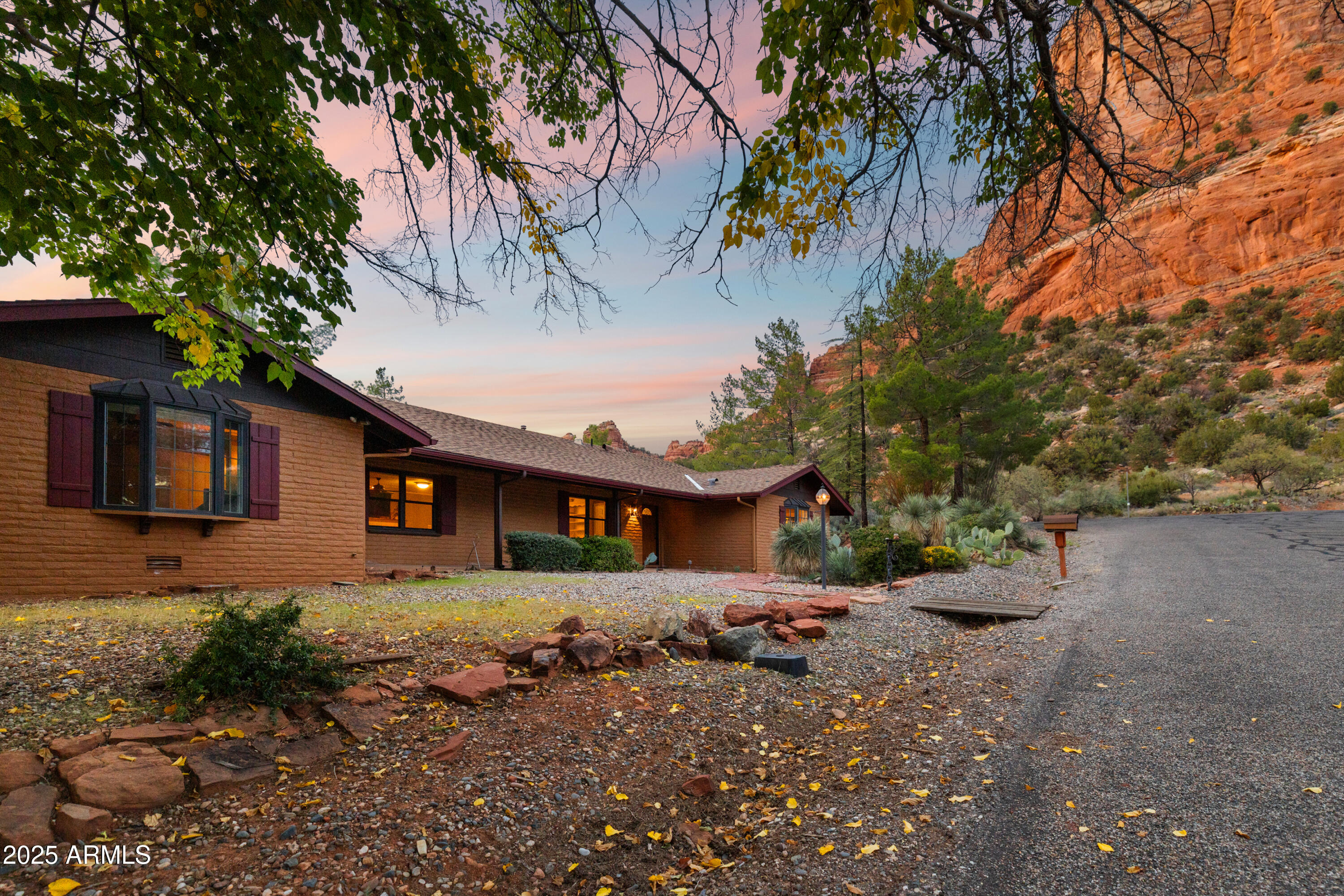 195 Courthouse Butte Road Sedona, AZ 86351 - Photo 2 of 31 a front view of a house with a yard and garage