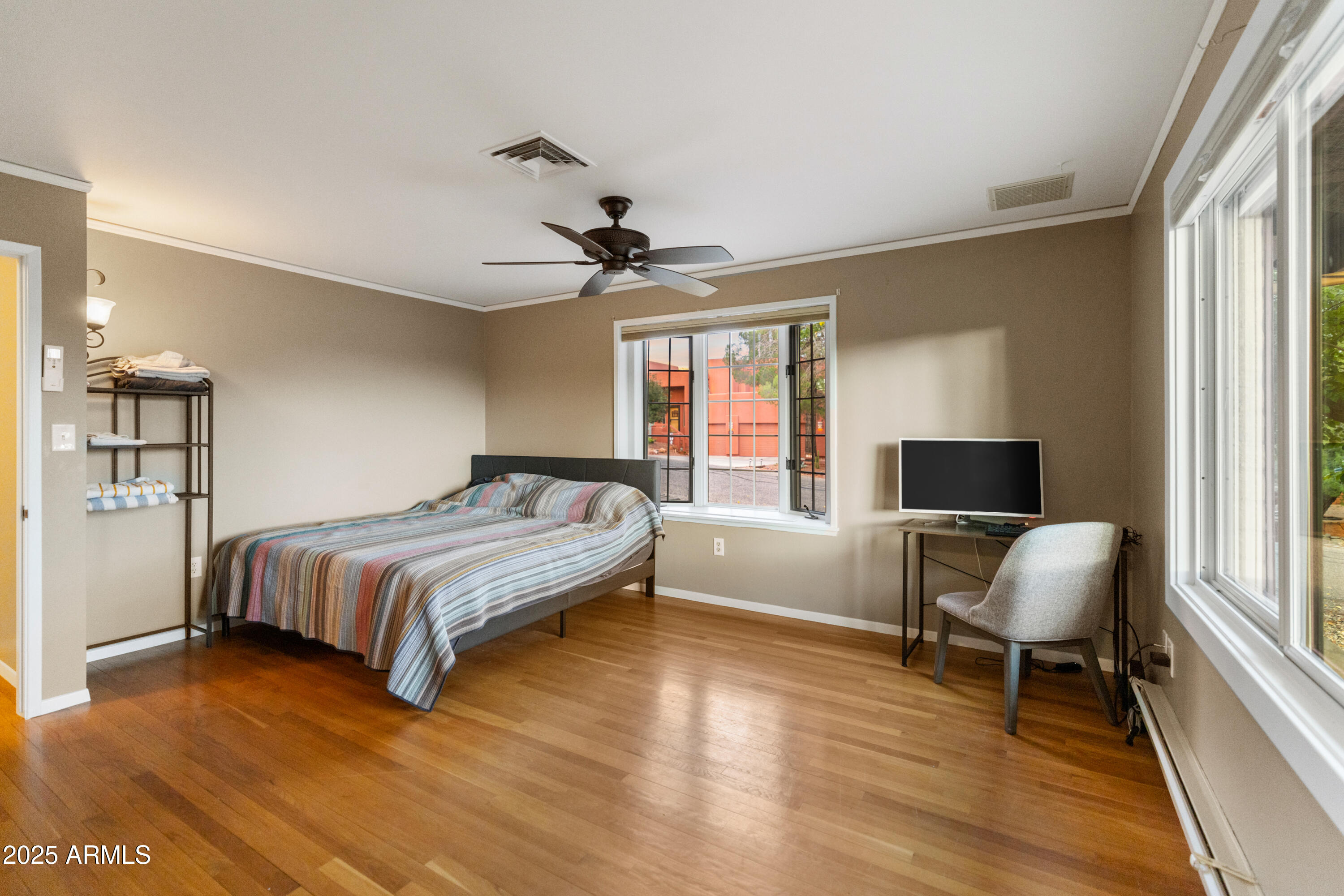 195 Courthouse Butte Road Sedona, AZ 86351 - Photo 27 of 31 a bedroom with a bed wooden floor and window