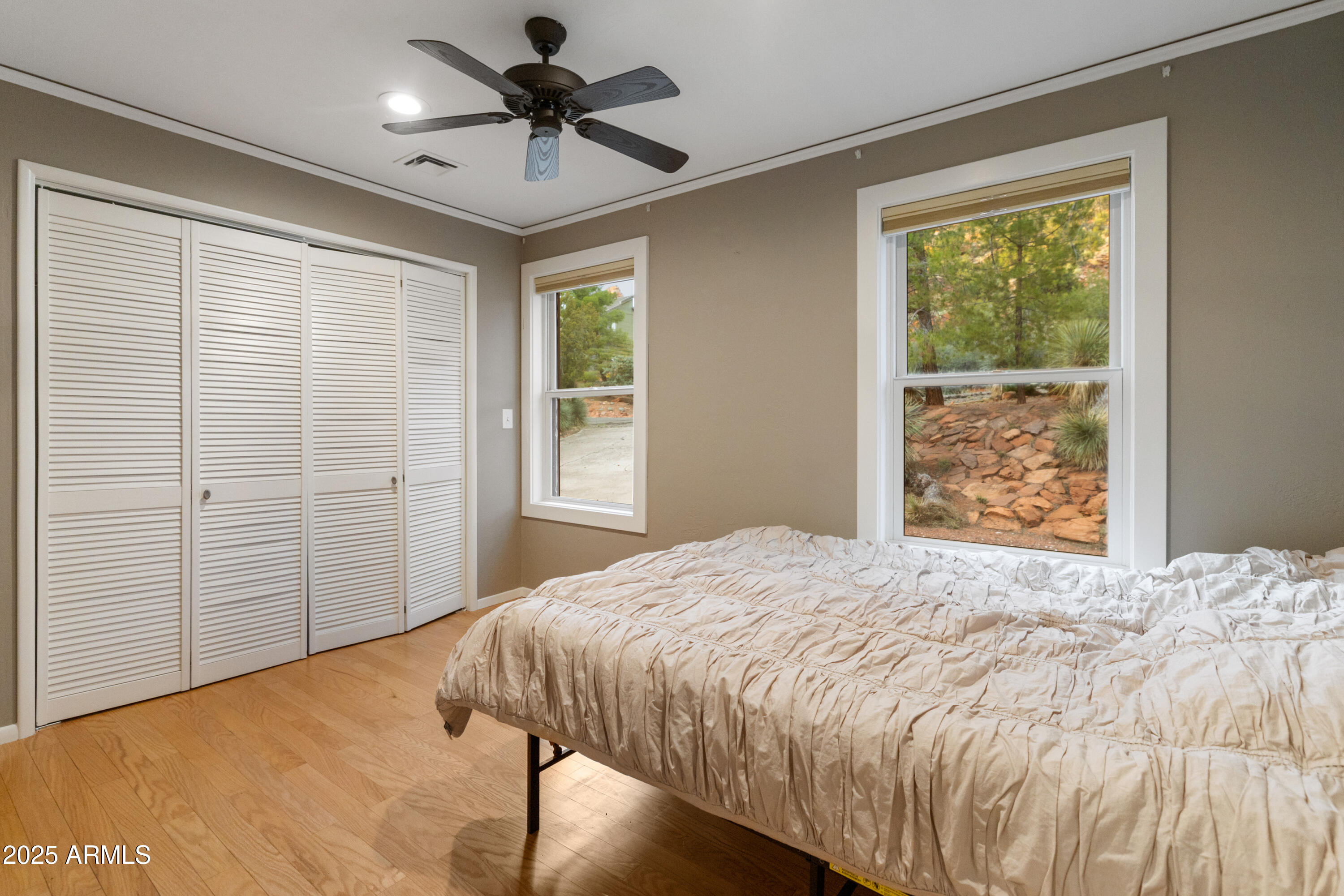 195 Courthouse Butte Road Sedona, AZ 86351 - Photo 29 of 31 a bedroom with a bed and a window