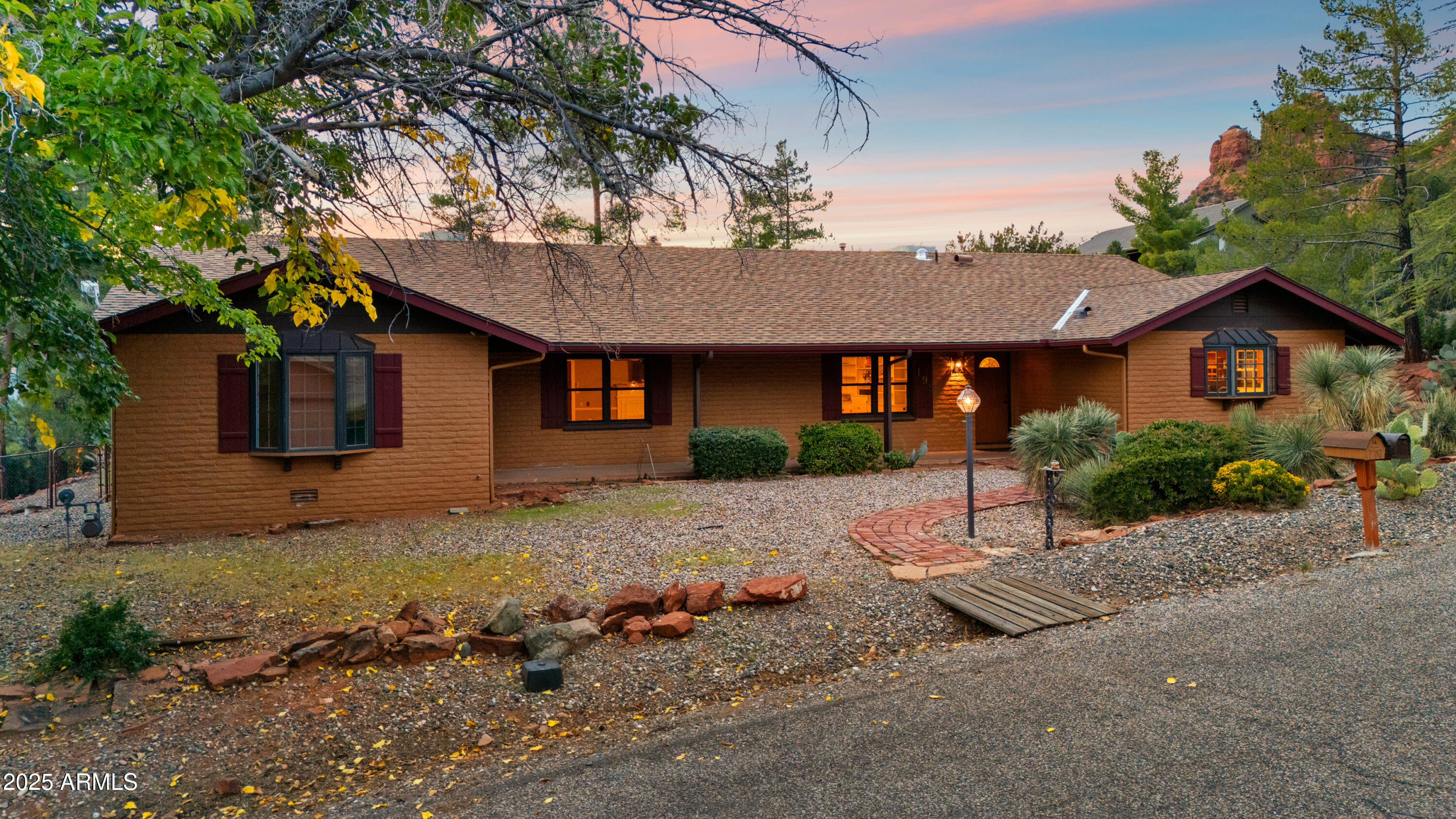 195 Courthouse Butte Road Sedona, AZ 86351 - Photo 4 of 31 a view of a house with a tree in front of it