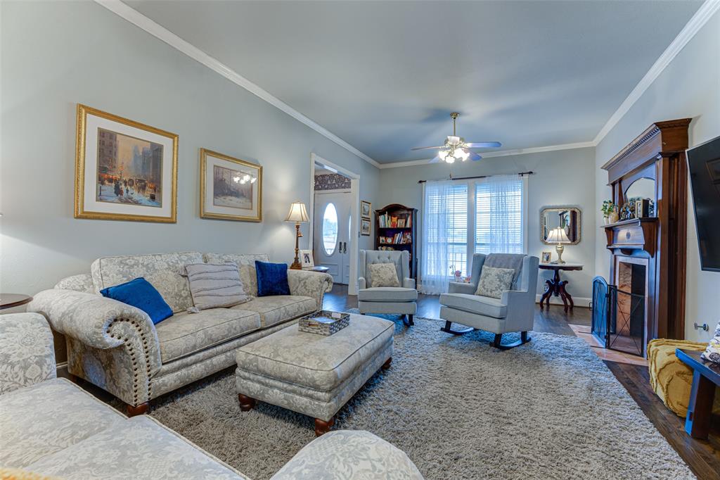 707 Cullins Road Rockwall, TX 75032 - Photo 11 of 35 a living room with furniture and a wooden floor