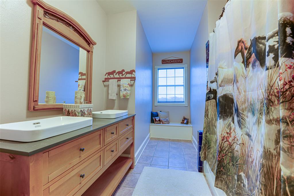 707 Cullins Road Rockwall, TX 75032 - Photo 20 of 35 a spacious bathroom with a double vanity sink mirror and shower