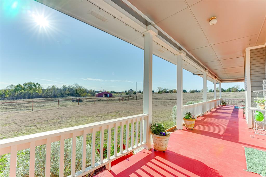 707 Cullins Road Rockwall, TX 75032 - Photo 23 of 35 a balcony with furniture and a lake view