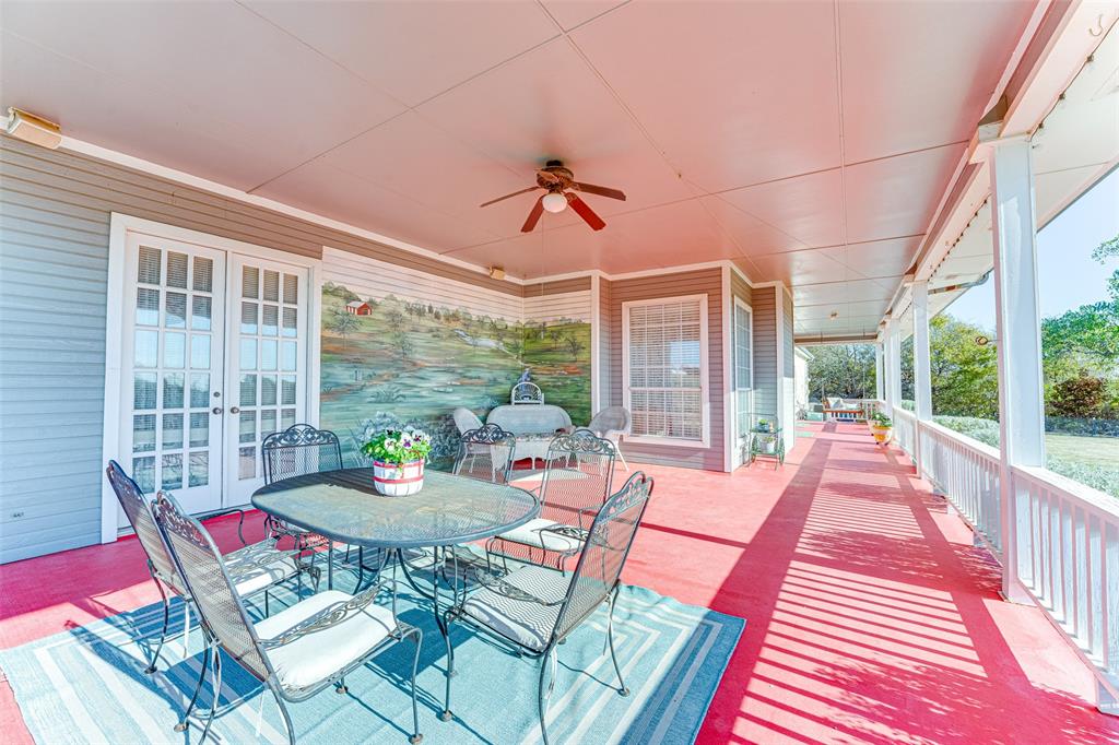 707 Cullins Road Rockwall, TX 75032 - Photo 24 of 35 a living room with furniture and a floor to ceiling window