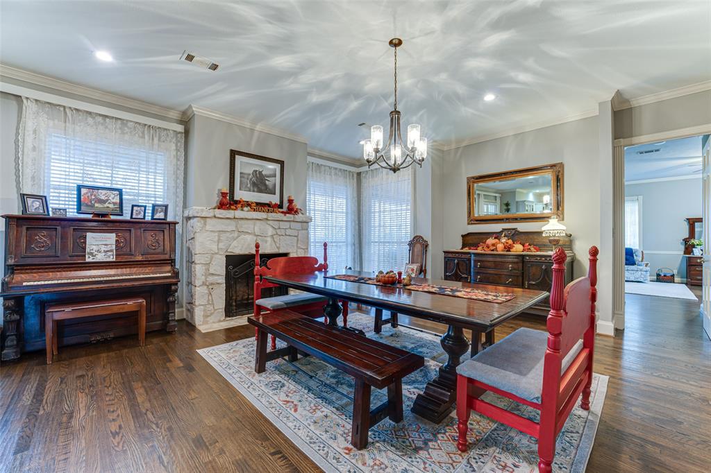 707 Cullins Road Rockwall, TX 75032 - Photo 31 of 35 a living room with furniture and a chandelier