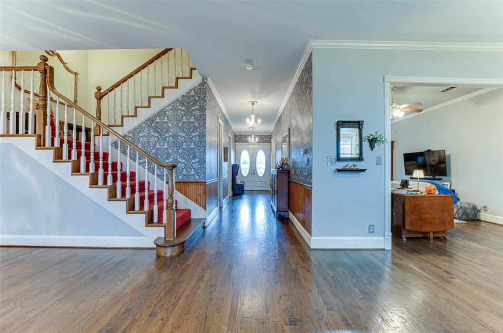 707 Cullins Road Rockwall, TX 75032 - Photo 7 of 35 a hallway with wooden floor and furniture