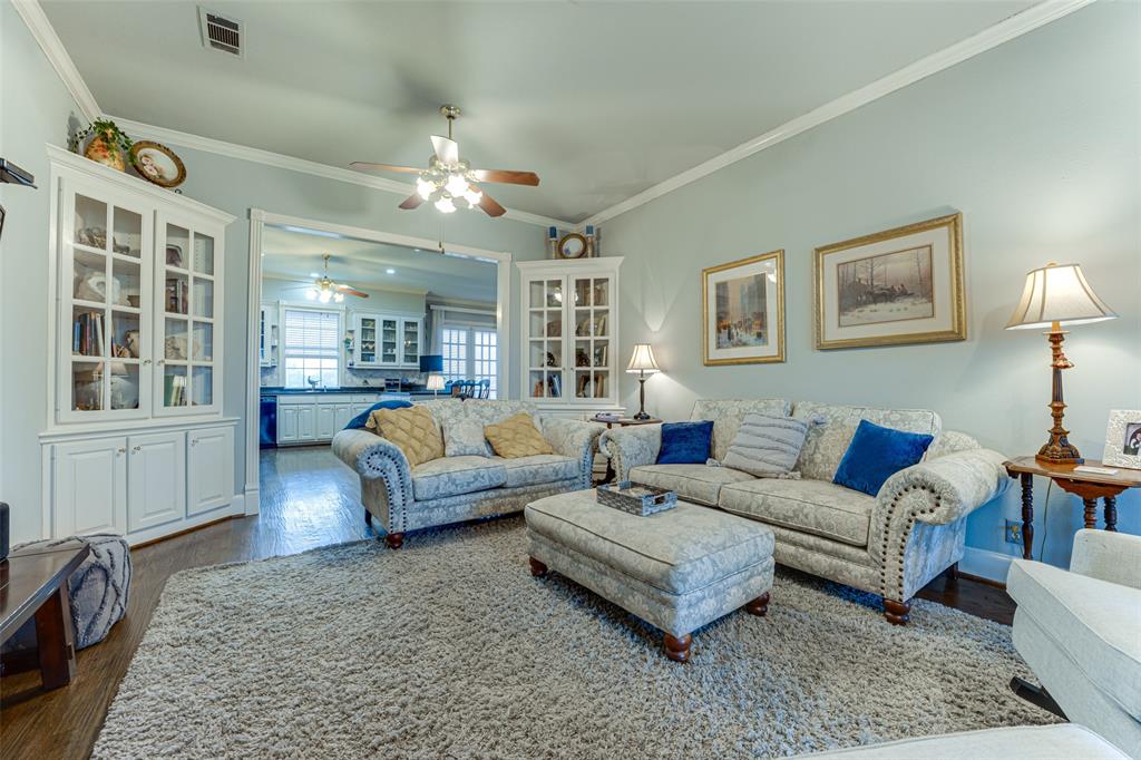 707 Cullins Road Rockwall, TX 75032 - Photo 8 of 35 a living room with furniture and a chandelier
