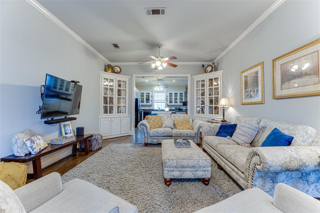 707 Cullins Road Rockwall, TX 75032 - Photo 9 of 35 a living room with furniture or couch and a flat screen tv