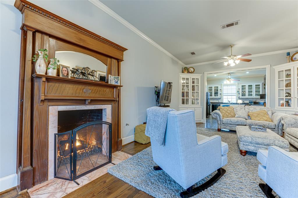 707 Cullins Road Rockwall, TX 75032 - Photo 10 of 35 a living room with furniture and a fireplace