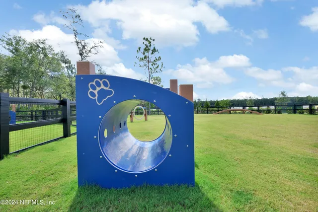 a view of a swimming pool with a yard