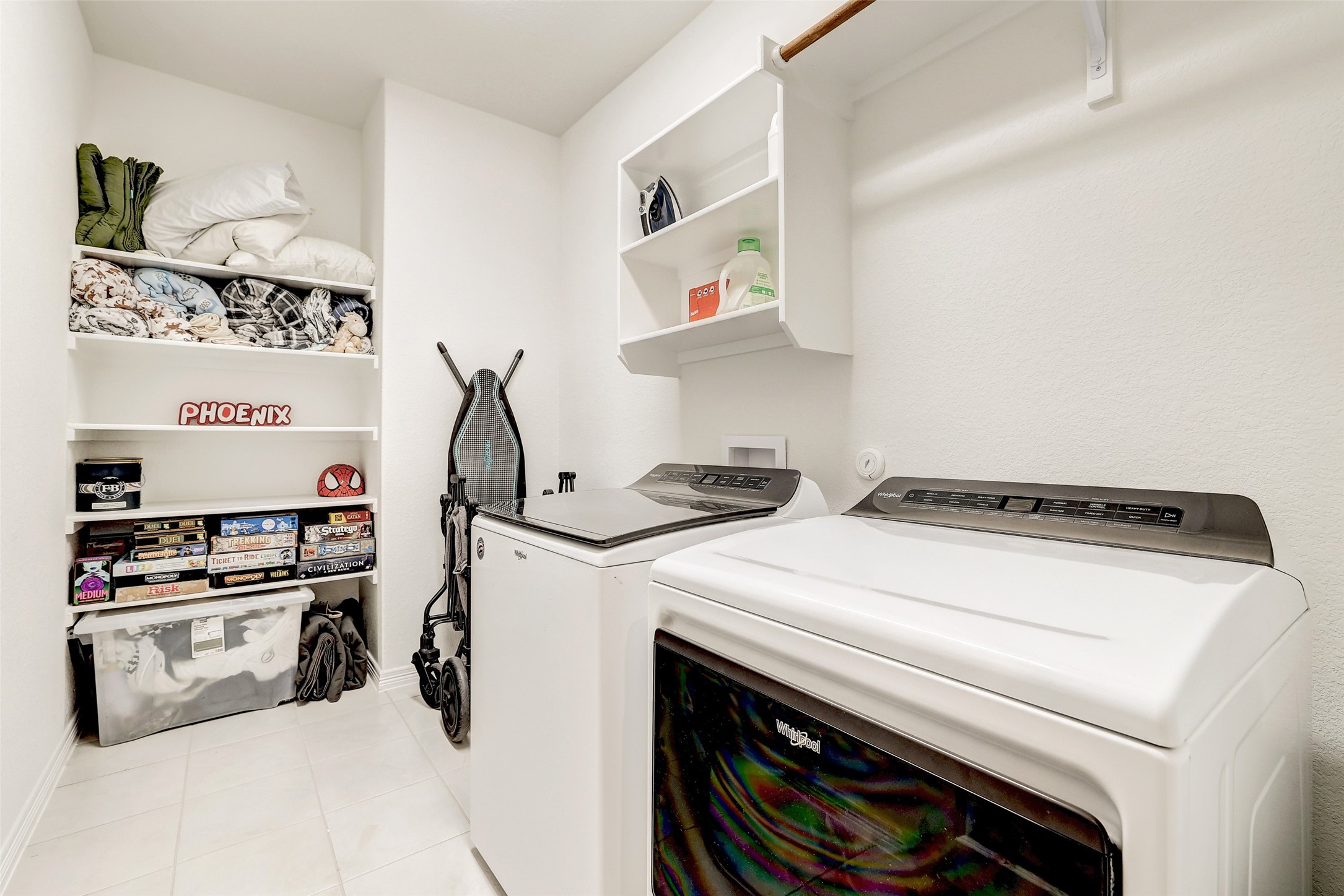 1117 Spring Gulch Lane Georgetown, TX 78628 - Photo 35 of 39 Functional laundry space featuring convenient shelving and a practical hanging rod.