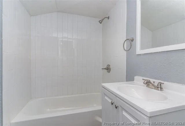 a bathroom with a sink and a bathtub