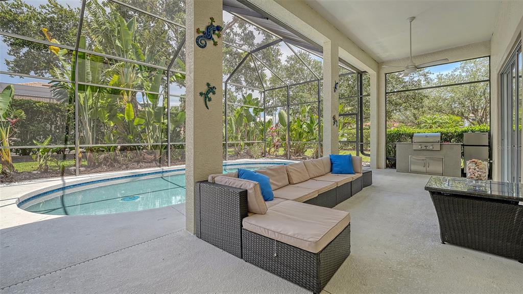 7717 US Open Loop Lakewood Ranch, FL 34202 - Photo 32 of 95 a living room with furniture and a large window