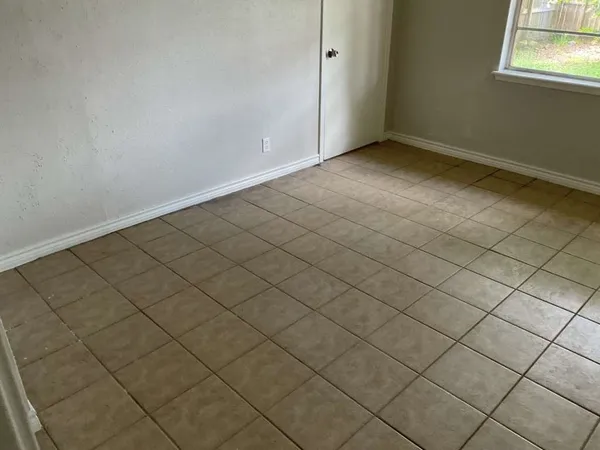 a view of a room and garage