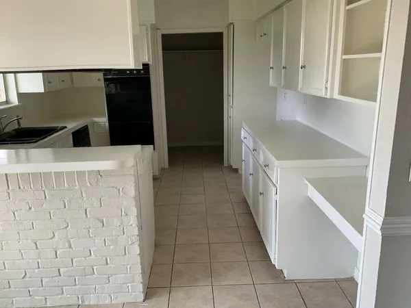 a hallway with cabinets