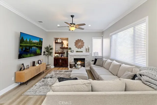 a large kitchen with stainless steel appliances kitchen island granite countertop a stove a sink a refrigerator and a granite counter tops with white cabinets