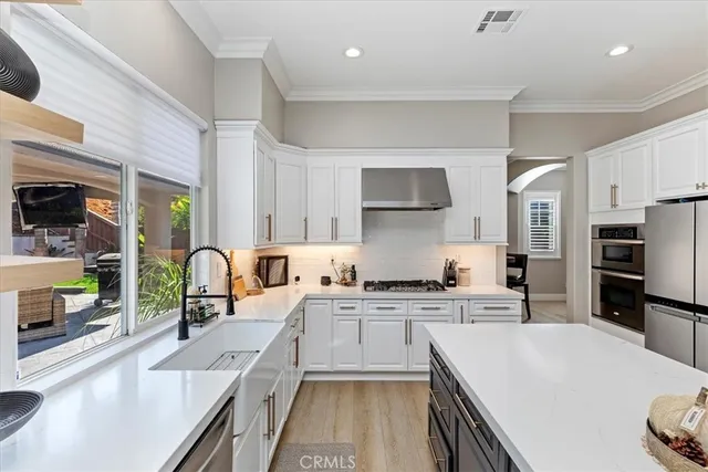 a kitchen with a table and chairs in it