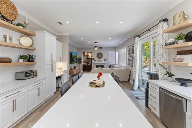a view of a dining room with furniture and a flat screen tv